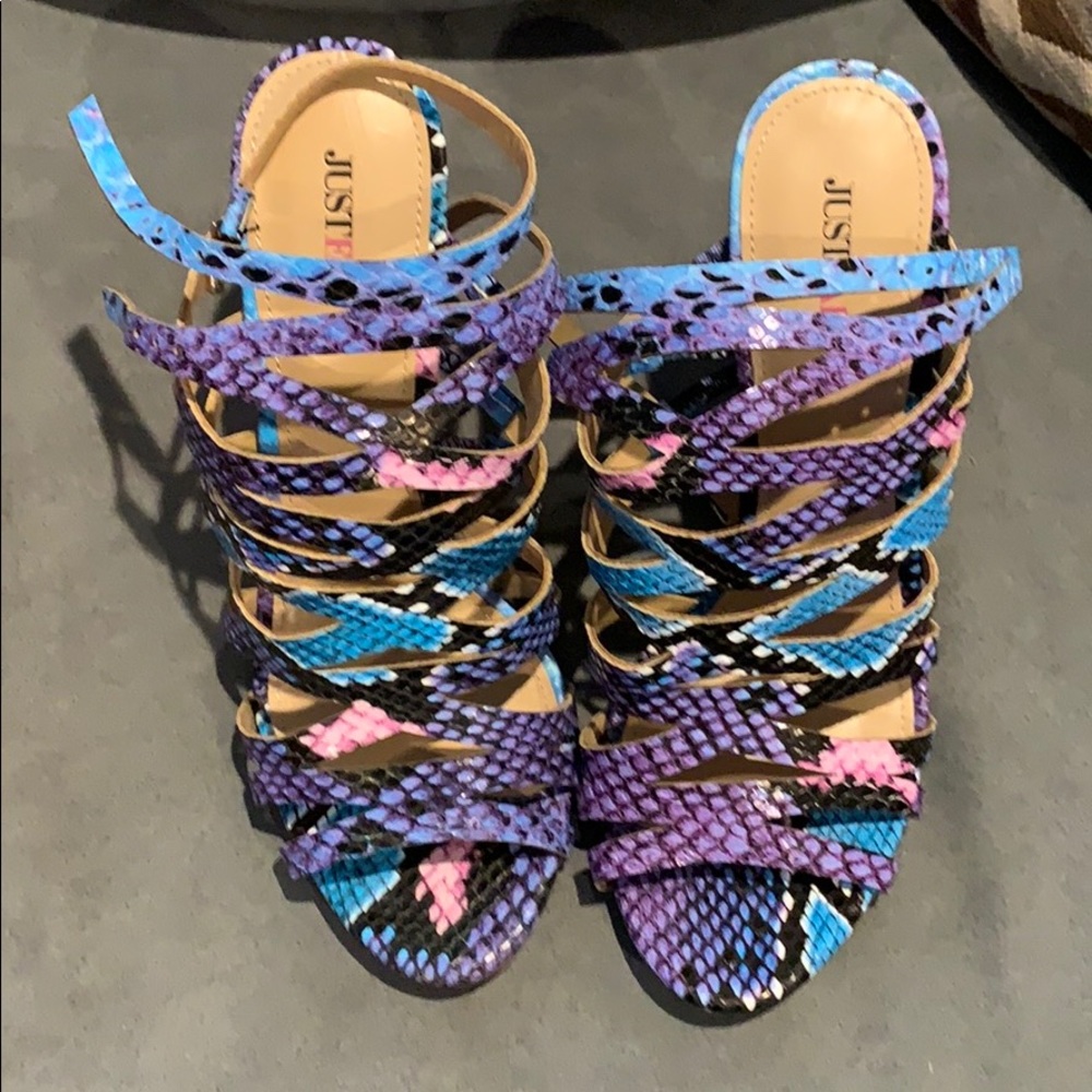 High-heeled, multi-colored sandals.